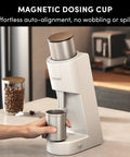 Top Tier Single Dose Coffee Grinder Built For Killer Extraction Features a silver magnetic dosing cup with auto-alignment.
