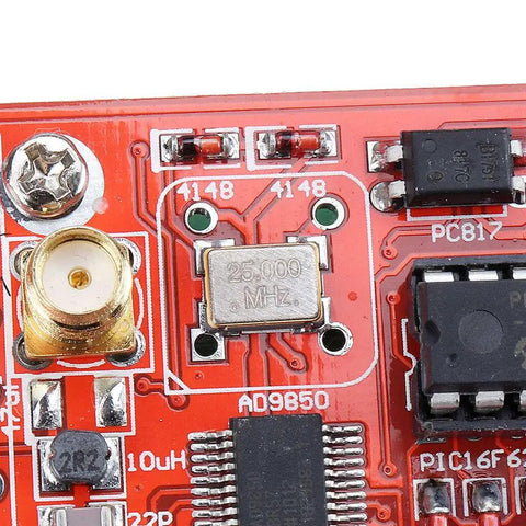 Close-up of Plug And Play DDS Signal Generator 0-55MHz for HAM Radio featuring AD9850 chip and 25.000 MHz crystal on PCB