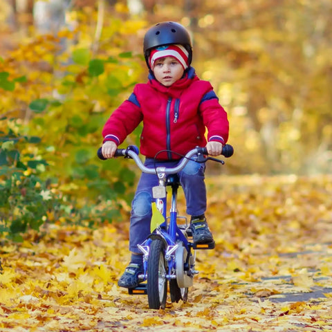 Child riding bike with Two Pack 12 1/2 Inch Bike Tubes For Road, Mountain And Kids Bikes Sized 12.5X1.75/2.25, autumn background