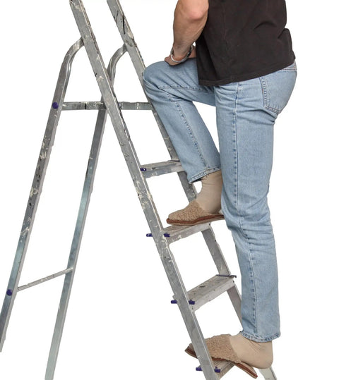 Person climbing a ladder wearing slippers, demonstrating safe access while inspecting smoke alarms with Heavy Duty Extendable Safety Pole With Killer Reach Ditch The Ladder Smoke Alarm Tester And Fire Sensor Checker Smooth Reach Emergency Exit Sign Tester For Top Notch Routine Care.