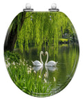 Round Graceful Swans Serene Willow Tree Reflected Calm Pond Toilet Seat on a serene pond with swans and greenery.