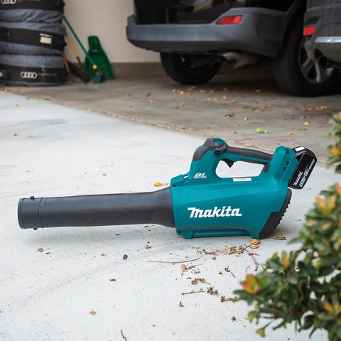 Renewed Brushless Cordless Leaf Blower with black nozzle on garage floor, great for yard work with 459 Cfm and 116 Mph blast.