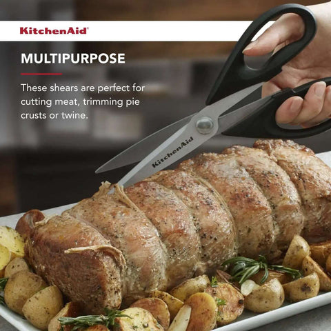 All Purpose Kitchen Shears with Protective Sheath cutting roasted meat, black handles, and stainless steel blades