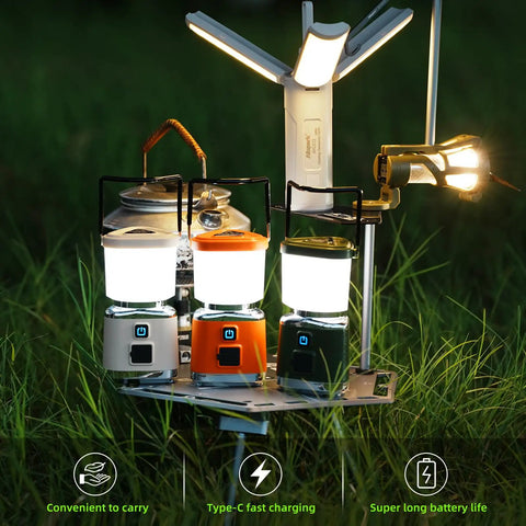 Three Hella Bright 1000 Lumen Rechargeable LED Camping Lanterns with Magnetic Bases on grass, showing four light modes.