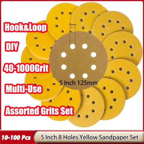 Premium 5 Inch Dry Sanding Discs With Hook Loop System Featuring Durable Aluminum Oxide Abrasive Paper For Smooth Woodwork And Metal Finishing Jobs Including Rotary Tool Use With Eight Holes For Amazing Dust Extraction Efficiency And Easy Attachment.