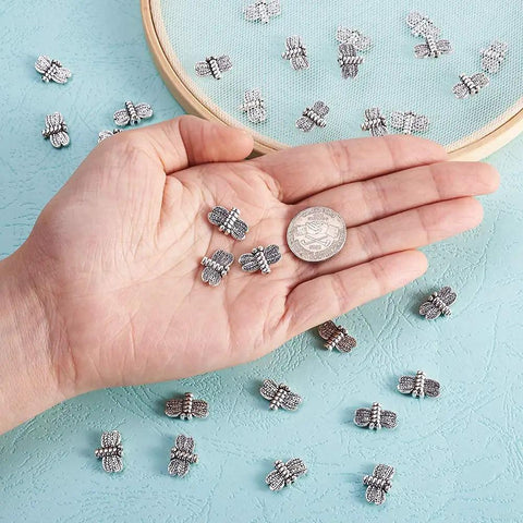 Antique Silver Dragonfly Spacer Beads Pack Of 50 For Jewelry Making 10x15mm Zinc Alloy Insect Charms With 1mm Holes in hand