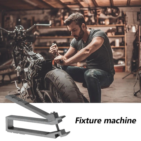 Mechanic working on motorcycle, highlighting fixture machine tool in garage setting.