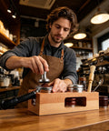 Buttery Smooth Espresso Tamper Station Crafted From Solid Natural Wood 58mm, used for coffee preparation in a café setting.
