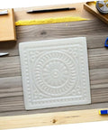 Square white DIY Concrete Stepping Stone Molds For Patio And Garden Paving Molds Set Easy To Use Cement Stone Molds on wood surface