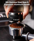 Level Up Your Home Cafe Setup With This Premium 58Mm Espresso Tamper And Coffee Distributor Bundle Including A Sharp WDT Tool For Even Distribution And Nailed Every Single Pull. Close-up of 58mm espresso tamper with stainless steel base on coffee grounds.