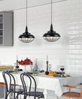 Sick Style Industrial Black Cage Plug In Pendant Light With Dimmable Switch Wall Outlet Fixture over dining table in bright kitchen setting.
