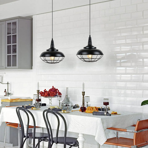 Sick Style Industrial Black Cage Plug In Pendant Light With Dimmable Switch Wall Outlet Fixture over dining table in bright kitchen setting.