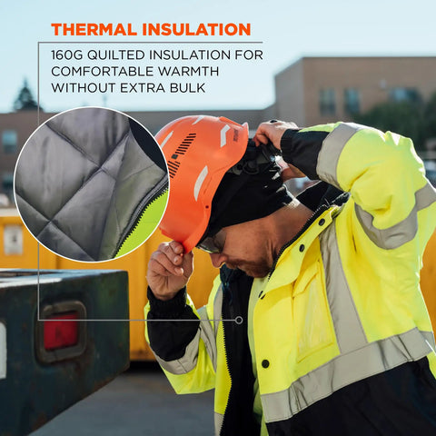 Worker wearing Hi Vis Safety GloWear 8377 Type R Class 3 Unisex Bomber Jacket Lime Quilted Insulated Coat, adjusting helmet.