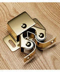 20 Pcs Metal Cabinet Latch For Wardrobe Door With Easy Install Spring Catch To Keep Kitchen Cupboards And Storage Units Locked Tight Secure And Stylishly, close-up of brass latch mechanism.