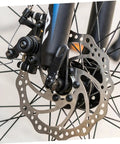Top Shelf Front And Rear Disc Brake Rotor Kit For Mountain Bikes With Silver Aluminum Build 160mm Diameter Mechanical Setup Dual Knob Adjustment To Legit Crush Every Gnarly Trail front disc brake rotor mounted on a mountain bike.