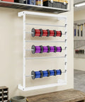 6 Rod Wall Mounted Wire Spool Rack Adjustable Cable Organizer For Garage Workshop Save Space Easy Install White Mounting Hardware Included Keep Cables Neat And Tidy Perfect For Office Or Industrial Use showing colorful spools in a workshop setting.