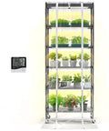 Indoor Greenhouse With Grow Lights And 6 Tier Plant Shelf On Wheels 150W Full Spectrum Grow Lights With 3 Color Modes For Seed Starting And Indoor Plants 29.5 L x 13.8 W x 71 H showing various plants with a digital thermometer display.