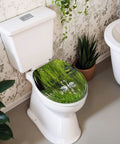 Round Graceful Swans Serene Willow Tree Reflected Calm Pond Toilet Seat on white toilet, showcasing resin material and soft-close hinge.
