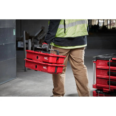 Gutsy Modular Tool Tray For Tradesmen Heavy Duty Plastic Organizer held by worker, red color, designed for job site tool organization.