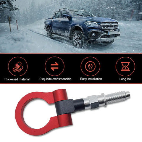 Red Alloy Car Front Bumper Tow Hook With Foldable Design, Rust Proof Recovery Ring For Fast Grab And Go Trail Rescue, Heavy Duty Screw Mount Pull Eye For Muddy Trail Beaters on snowy road with pickup truck.