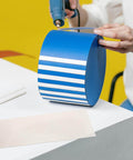 Person using heat blower on blue object near Mica Insulating Paper Kit For Heat Blower, 15 Sheets, Pro Grade thermal barrier paper.
