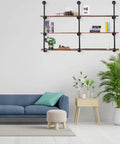 Living room featuring Industrial Iron Pipe Shelving Brackets Unit For Farmhouse Wall Mounted Shelves with decor items and a blue couch.