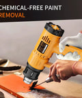 Person using Go-To Heavy Duty 1800W Heat Gun Kit With Dual Temperature 662F And 1112F for paint removal with protective gloves.