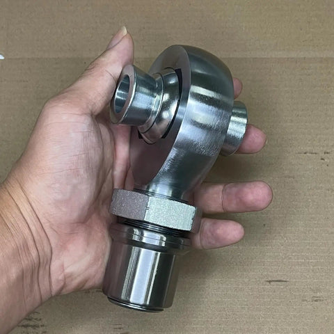 Built Tough 1.25 Inch Heim Joint Rod End Kit Left Hand Thread Chromoly Steel Heat Treated Panhard Rod held in hand.