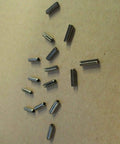 Stainless Steel Grade 420 Slotted Tension Roll Pins 1/8 X 7/16 Inch Pack Of 25 on a surface, ideal for various projects.