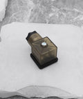 Two Pack 3 Pin 2W DC 12V To 14V Solenoid Valve Coil With LED Indicator Connector DIN 43650A PG11, brown, on stone surface.