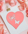 Heart-shaped card with butterfly cutouts using Five Set Metal Cutting Dies And Stencil Kit With Thirty Two Pcs Templates for scrapbooking.