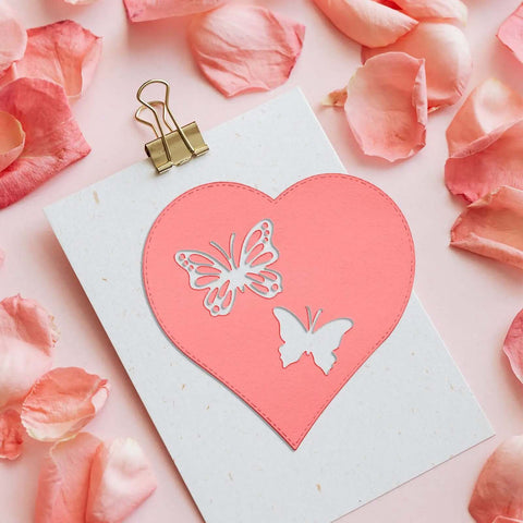 Heart-shaped card with butterfly cutouts using Five Set Metal Cutting Dies And Stencil Kit With Thirty Two Pcs Templates for scrapbooking.