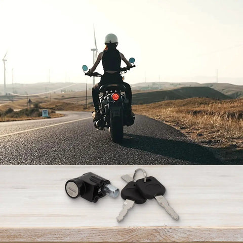 Electric Bike Battery Lock And Key Kit displayed on table with scenic road and rider in background, silver metal lock