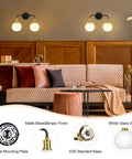 Dope Two Light Vanity Light Over Mirror 17 Inch Black And Gold Wall Sconce Lighting With White Glass Globe Shades Mid Century E26 Socket Damp Location Bathroom Fixture Bulbs Not Included mounted on wood paneled wall above couch
