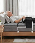 Senior using Bedside Grab Rail For Seniors With Storage, L Shaped Bed Rail For Safety And Mobility, Sturdy Carbon Steel Frame
