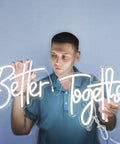 Man holding "Better Together" LED sign, part of Custom Mr And Mrs Neon Sign For Wedding And Engagement LED Lights Lighted Display