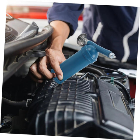 Mechanic using 80cc Mini Grease Gun Portable Manual Lubrication Tool With Sky Blue Electroplated Finish on car engine