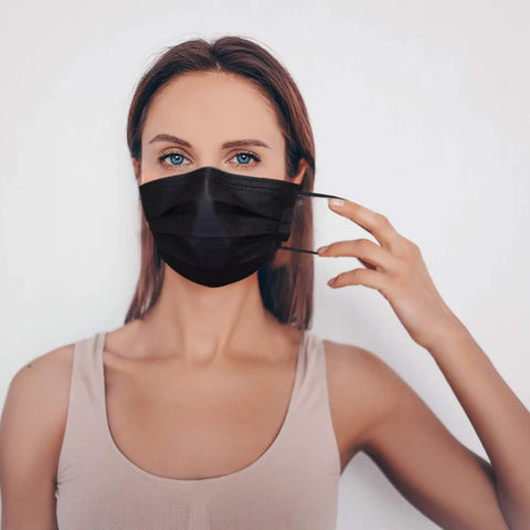 Person wearing IMask Premium ASTM Level 3 Face Mask Black Pack Of 50 With Soft Multilayer Nonwoven Fabric And High Fluid Resistance