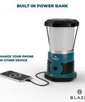 Beast 1500 Lumen Rechargeable LED Lantern With 12000mAh Power Bank, 360 Degree COB Lighting For Blackouts, Storms, And Emergencies, 85 Hour Runtime Teal, showing phone charging feature.