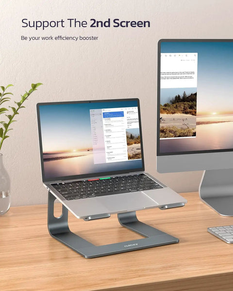 All Aluminum Laptop Stand For Desk Setup With Ventilated Cooling Detachable Ergonomic Riser holding a laptop on a desk