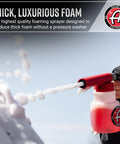 Foam Gun Car Wash Sprayer For Garden Hose No Pressure Washer Needed spraying thick foam from red nozzle attachment.