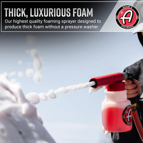 Foam Gun Car Wash Sprayer For Garden Hose No Pressure Washer Needed spraying thick foam from red nozzle attachment.