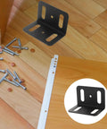 Beefy Heavy Duty L Shape Iron Corner Bracket Set 4 Pieces Right Angle Shelf Braces on wooden floor with screws visible
