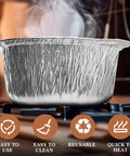 12 Pack Disposable Aluminum Pots With Lids Set For Camping And Travel Cooking on stovetop with steam rising