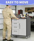 Person using Beefy Metal Garage Storage Cabinet On Wheels With Lockable Drawer And Shelves in garage