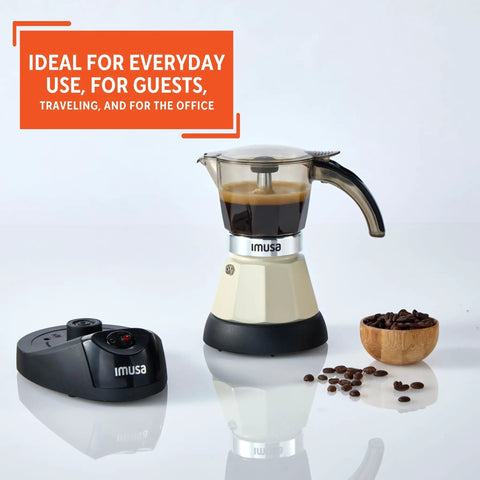 Dang Compact Two Cup Electric Espresso Maker With Cool Touch Handle Brews rich smooth coffee on countertop with coffee beans.
