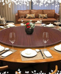 Extra Large Lazy Susan Turntable For Dining Table 20 Inch Wooden Rotating Serving Tray For Kitchen Organization Black Round Serving Platter Perfect For Parties And Get Togethers on a dining table set for dinner with wine glasses and plates