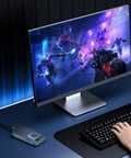 Gaming setup featuring Ridiculously Fast M.2 NVMe SSD Enclosure With Built In Quiet Cooling Fan for seamless gaming and 8K video edits.