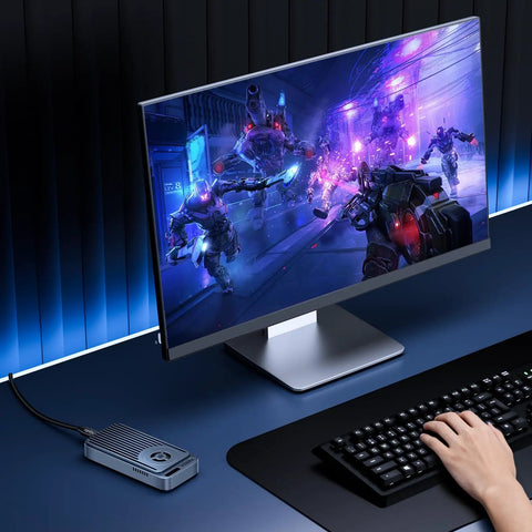 Gaming setup featuring Ridiculously Fast M.2 NVMe SSD Enclosure With Built In Quiet Cooling Fan for seamless gaming and 8K video edits.