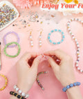 Person crafting with Crystal Rondelle Spacer Beads Kit 1200 Pieces in 6mm 15 Bright Colors for DIY Jewelry Making Totally Perfect for Bracelets